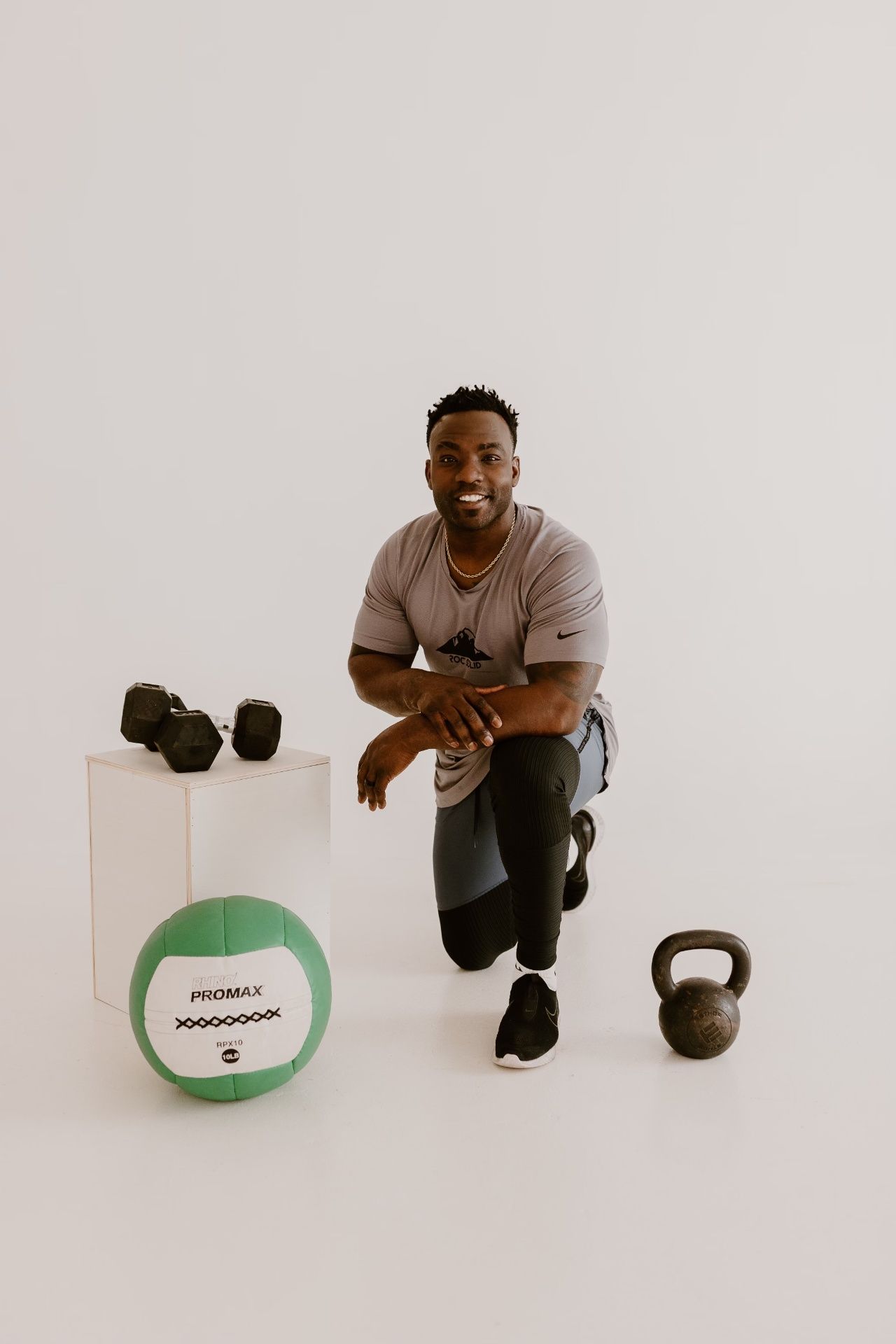 Coach Ben Birmingham in the Roc Solid training facility — community and mentorship in Edmond, OK